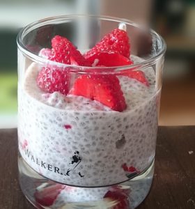 How to make a healthy chia pudding with an image of chia pudding with strawberries.