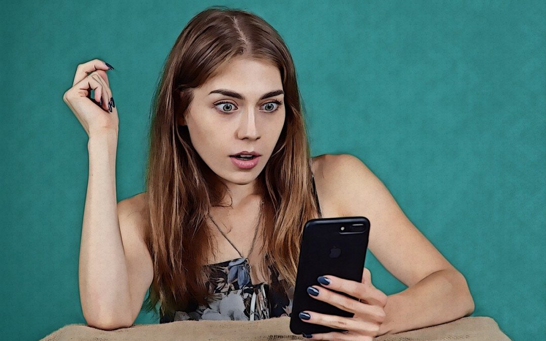 An image of a girl reading her phone in shock as she learns the history of modern medicine.