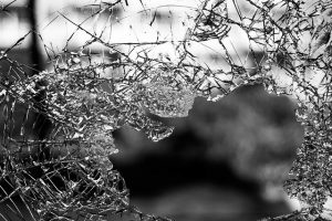 An image of broken glass to discuss how our healthcare system today is very broken.