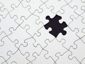 An image of a white puzzle with a piece missing to discuss how there often is no one-size-fits-all approach to healing a health condition.