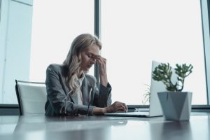 An image of a girl at work who is stressed to talk about how stress is bad for the immune system..