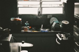 An image of a dirty kitchen to discuss how your body is your home and if you don't keep it clean by making choices to strengthen your immune system you will be more susceptible to diseases.