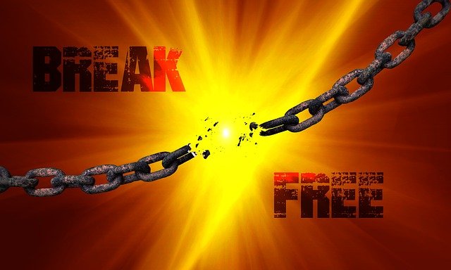 An image with a chain breaking and the words "Break free" to represent breaking free from the ways you are brainwashed by the healthcare industry to live healthy.