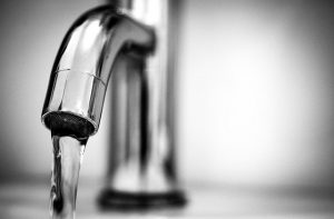 An image of a water faucet to talk about how water from the tap is often not safe for drinking, and it is best to have a reverse osmosis system.