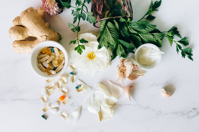 An image of vitamins and herbs to discuss how there are no strict regulations on vitamins. So they are not as natural as we are made to believe.