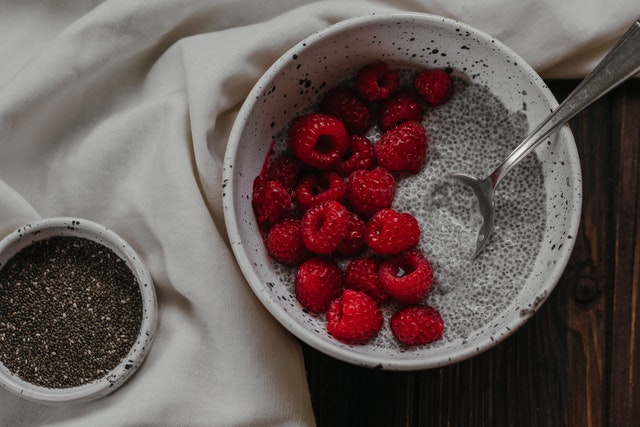 An image of a bowl of chia seeds and chia seed pudding to talk about its benefits as a superfood and the essential vitamins and minerals in contains.