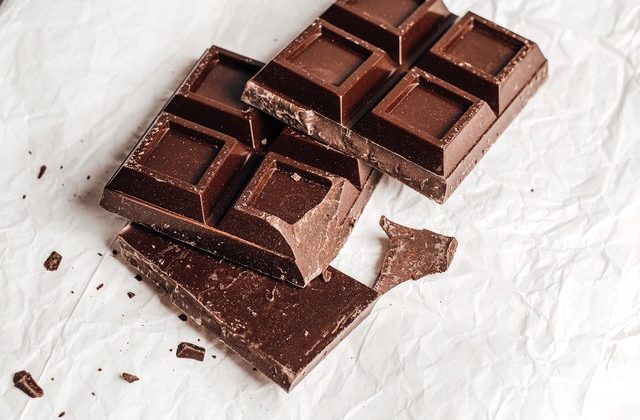 An image of dark chocolate pieces to talk about its benefits as a superfood and the essential vitamins and minerals in contains.