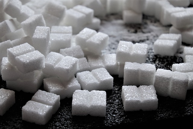 An image of sugar cubes to discuss how to avoid artificial sweeteners and consuming less sugar.