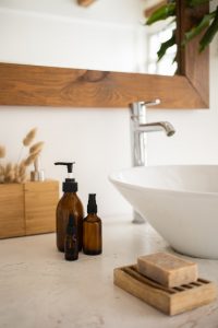 An image of a sink with some skincare products next to it to talk about how to get started with switching to less toxic skincare.