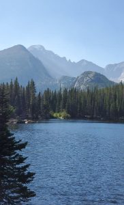 An image of a lake with mountains to talk about how my soul craves nature and new adventures.