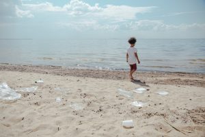 An image of plastics on a beach to talk about the dangers of plastic to the environment.