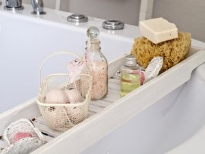 An image of soaps and bath salts on a tub to talk about how you can detox when taking a bath.
