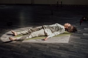 Another image of a person laying down to meditate to talk about the different types of meditation and how it works.