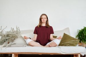 An image of a person meditating to talk about what meditation is.