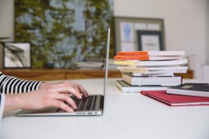 An image of a person doing research on a computer to emphasize the importance of researching to find the truth. 