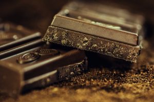 An image of some bars of chocolate to talk about how you can still have some sweet treats even when you are on a diet to lose weight. 