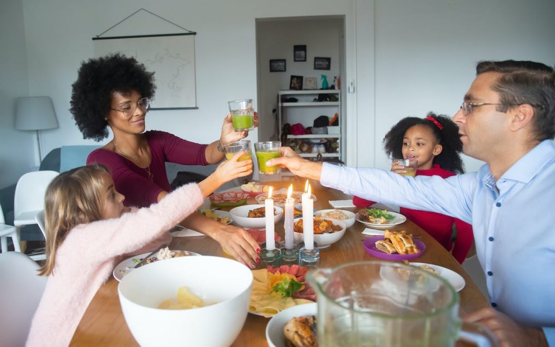 Image of a family eating a healthy meal together to talk about how to ditch dieting and instead adopt a healthy eating lifestyle.