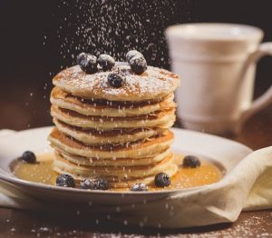 An image of a pile of pancakes to talk about how eating a lot of sugar for breakfast can cause brain fog. 