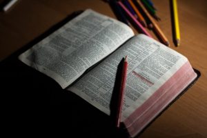 An open bible to talk about all the bible verses related to forgiveness and continuing to live a sinful lifestyle. 